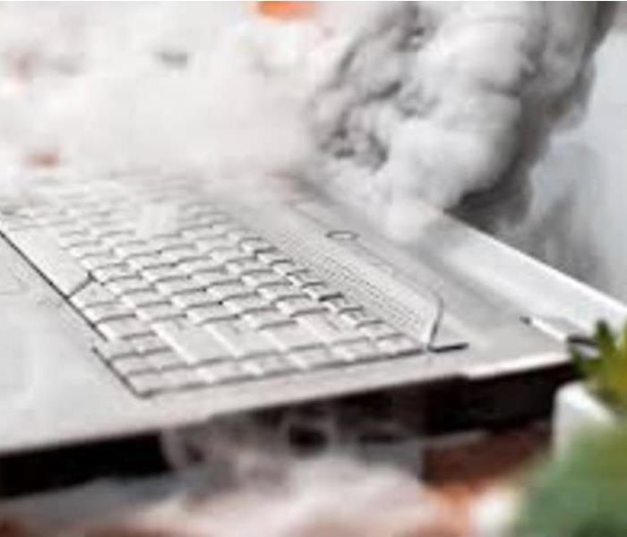 smoke coming from a laptop computer
