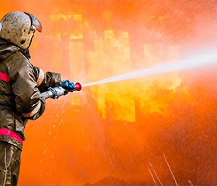 fire fighter extinghing a fire